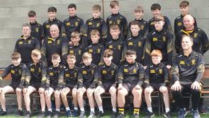 Arravale Rovers boys fly the Tipp  flag at Feile