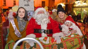 Eve and Muireann help Santa turn on Christmas  lights in Tipperary Town