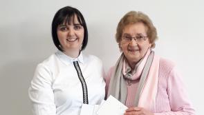 Snapshots winner Kathleen collects her prize
