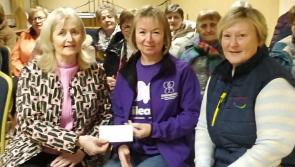 Local Tipperary social club presents generous donation to charity