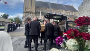 Hearses carrying coffins of Grace and Luke McSweeney arrive at Clonmel church