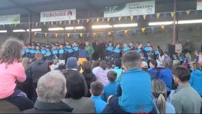 WATCH: "The Cup isn't home until Tom Comerford's hat is thrown!"