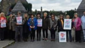 Protest stops work on erection of barriers to prevent cars entering Clonmel cemetery 