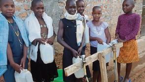 Ugandan children enjoy fresh water from Roscrea