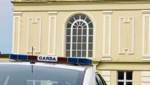 Cashel Court: Damaged front door and car with an axe