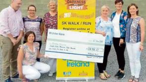 Tipp Town's Huge cheque for Darkness Into Light