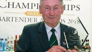 Tipperary bartender Andrew O'Gorman raises a glass after he receives lifetime award