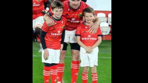 PICTURE: Young mascot from Moycarkey joins Munster captain for a pre-match photo in Thomond Park
