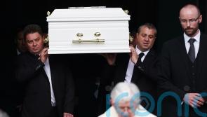 Siblings who died in car fire ‘inseparable in life’, mourners told