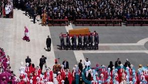 Quiet reverence and a ripple of applause for ‘the people’s pope’