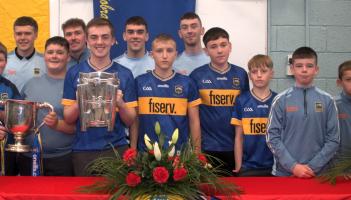 Carrick-on-Suir school honours hurling star past pupils during visit with All-Ireland cups