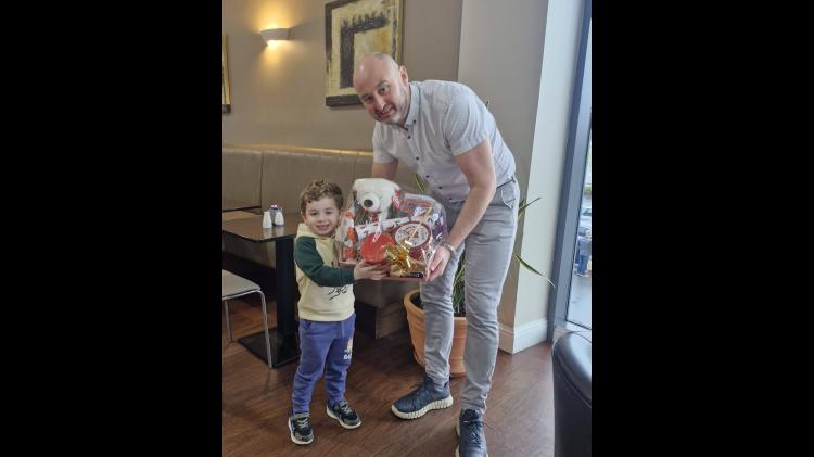 PICTURE: Young Tipperary boy presented with Christmas hamper from Irish Guide Dogs