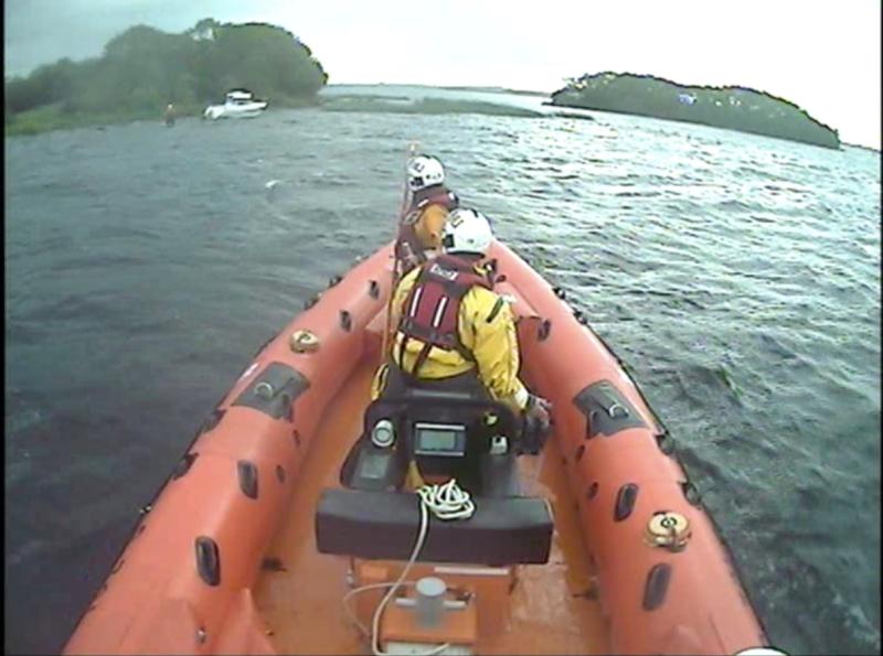 Lough Derg RNLI  assist passengers on a 40ft cruiser ran aground by Hare Island