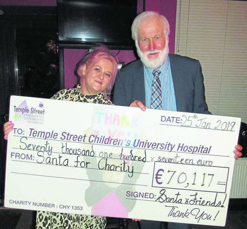 Local "Santa" John Holohan presents €70,000 to Temple Street Children's Hospital