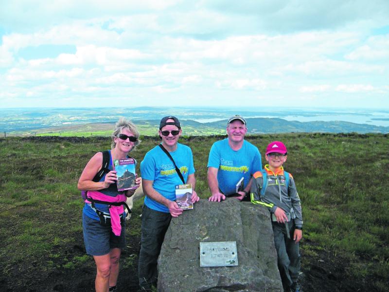 Twelve year old Dillon scales the heights  with support of his Clogheen family