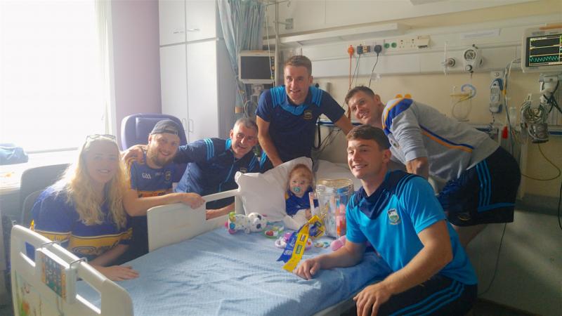 Liam Sheedy's All-Ireland champions visit Tipperary girl (1) with cancer at Temple Street 