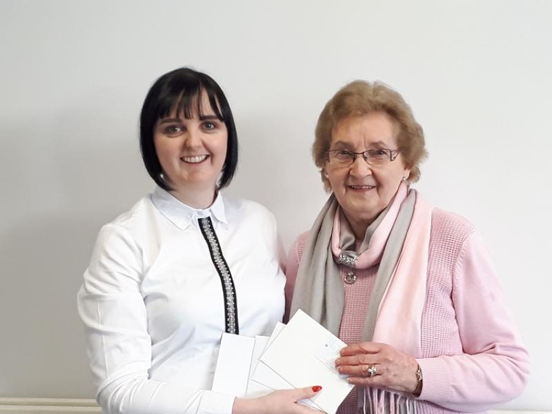 Snapshots winner Kathleen collects her prize