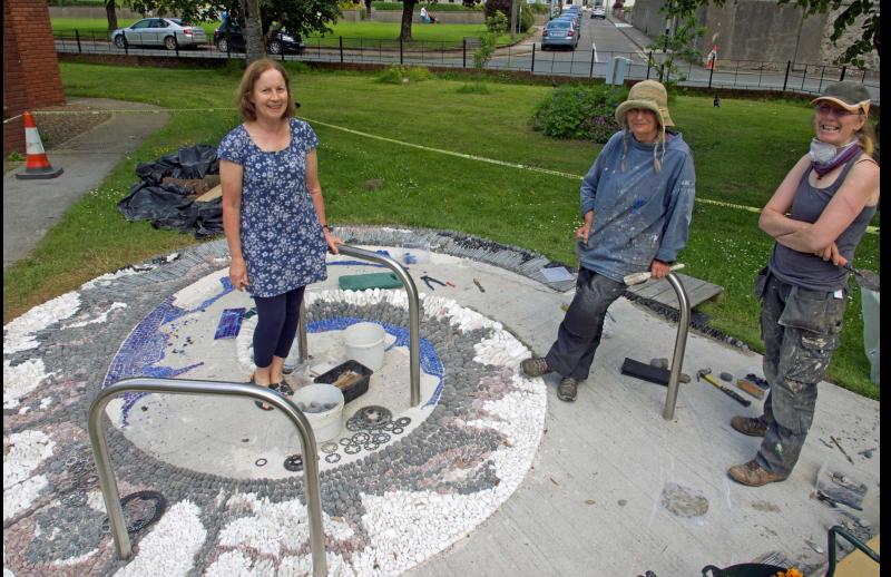 Artists create mosaic art work at county Tipperary library bike stand