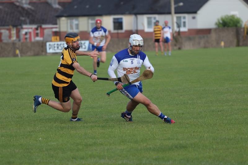 Cormac Maher (Arravale Rovers), tries to catch Ross Dunne (Cappawhite) in the Crosco Cup 1/4 Final