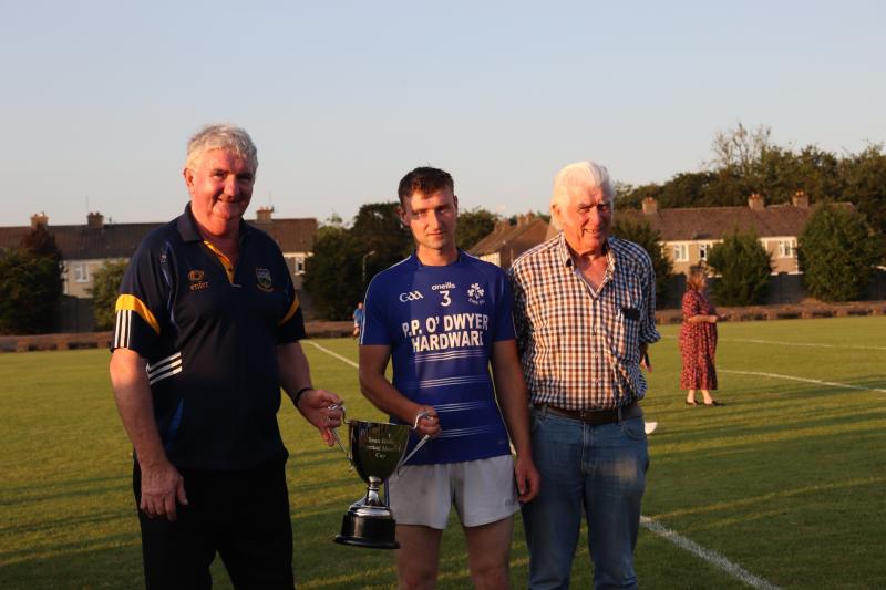Michael Ryan C (West Board Chairman presents the Sean Breen Cup to Eire Og Annacarty Donohill Captain Cathal Coughlan, while also in the picture is John O'Shea representing the sponsors Maria Marron, 