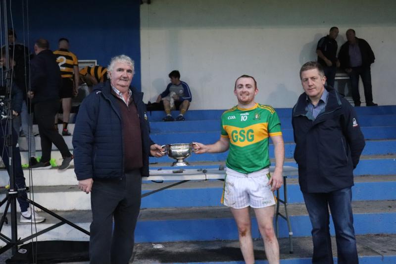 Michael Ryan C, Chairman of the West Board presentes the O’Carroll Cup to Aherlow captain Ed O’Meara in the presence of Shane Hennessy who sponsors the competition.
