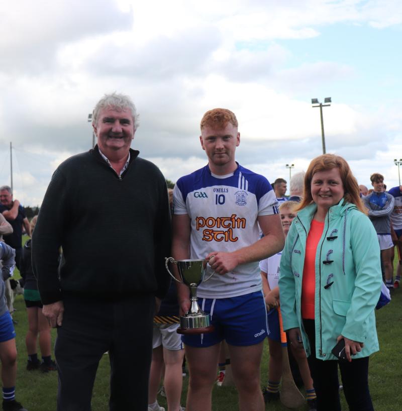 West Board Chairman Michael Ryan C, presents the Farrell Cup to Cappawhite captain Willie Barry in the presence of Catherine Hogan of Tipperary Credit Union.