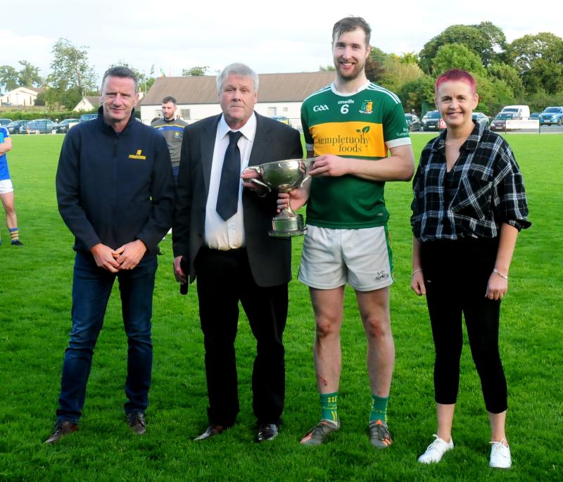 Moyne Templetouhy's Captain Tossy Hamill is presented with the Roadstone sponsored Mid Intermediate Hurling Final trophy by Mid Chairman Joe O' Sullivan and Mid Secretary Catherine Dunne, and Roadston