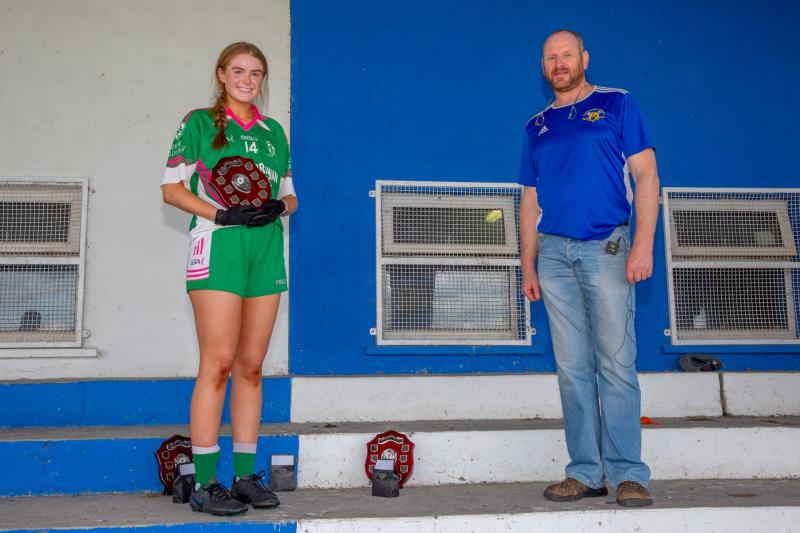 Holycross Ballycahill captain Elaine Brennan accepts the cup from Lar Roche