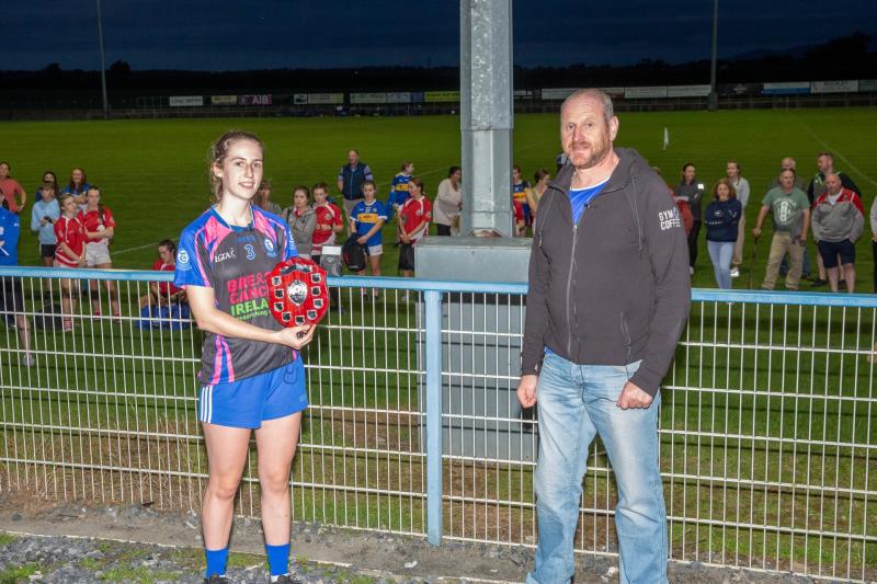 Templemore Captain Ava Ormond with the John Kennedy Motors Division 1 trophy pictured Chairman Lar Roche  Tipperary LGFA