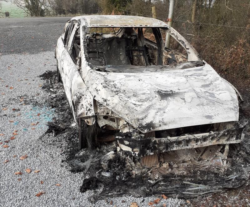 SHOCKING: Burnt-out car left abandoned at the entrance to a popular Tipperary walkway