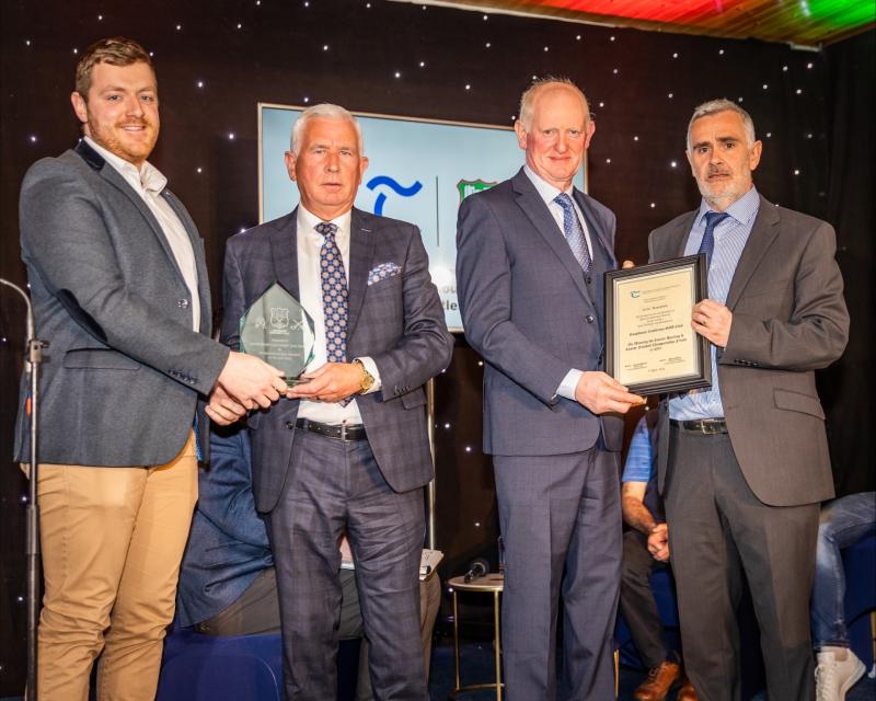 , Cllrs Seamus Hanafin and Eddie Moran present Richard Maher Club Secretary, and Brendan Meagher, Club Chairman, with the momentos of the occasion