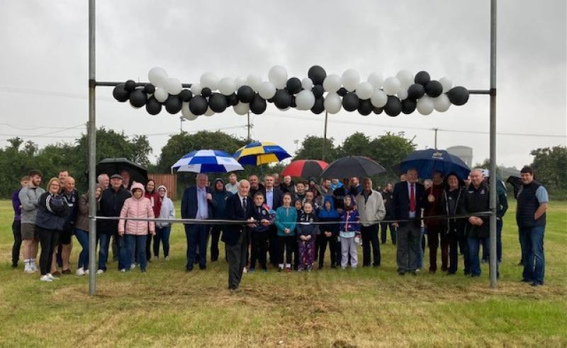 Club President Michael Guinan  cuts the ribbon ro open the pitches
