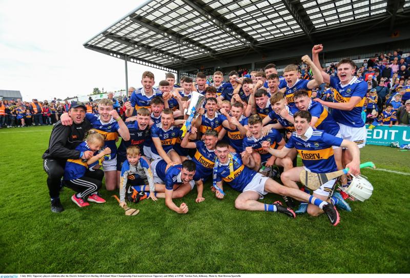 The victorious Tipperary minor hurling team celebrate with the silverware