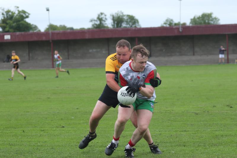 Eoin Riordan (Solohead) comes under pressure from Micheal Ryan (Arravale Rovers) in their Maria Marron Palmers Hill Stud WJAFC semi-final meeting - Picture Francis Ciughlan