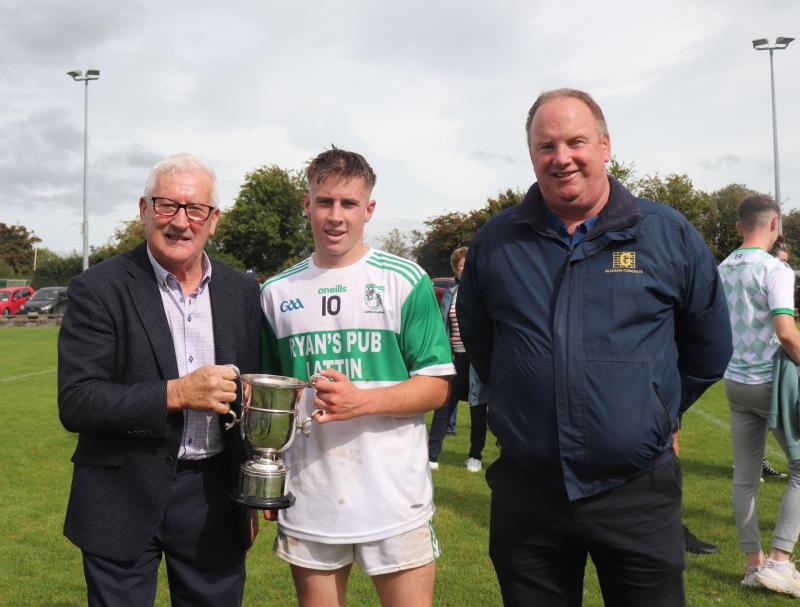 West Board Chairman Tom Hayes presents the cup  to  Jack O'Halloran with Micheal Gleeson of Gleeson Concrete also included.