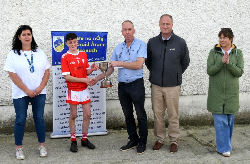 Mid Bord na nÓg Chairman PJ Bowden presents the Mid U13 Grp 1 Cup to Durlas Óg captain Ciaran O'Mahoney, also pictured are Michelle Spillane-McKelvey Mid Bord na nÓg secretary, John Martin and Aishlin