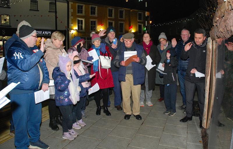 Fr Tom Corbett,  seen here leading the group in Prayer, blessed the crib in Roscrea at the weekend in the presence of a number of locals who delighted in seeing the crib ready fo rviewing for the gene