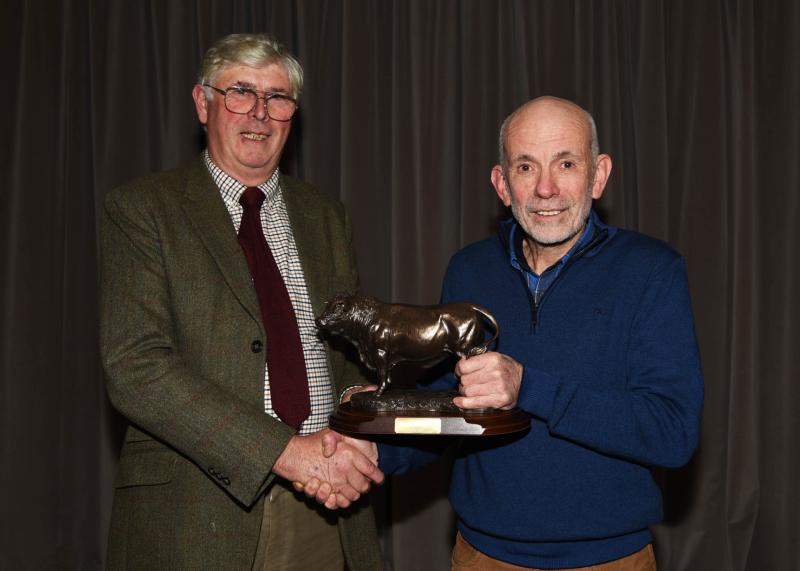 Tom Berkery, Chairman, Templemore Livestock Mart, making presentations to John Sullivan