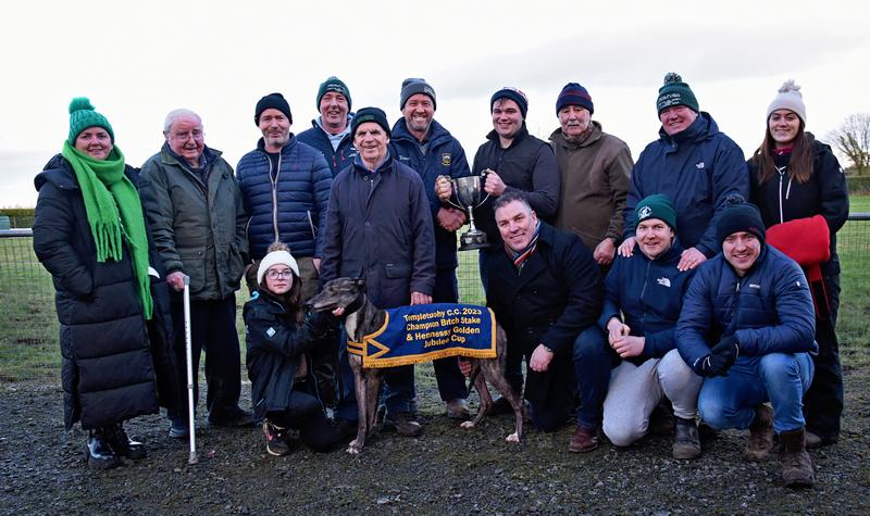 All Aged Bitch Stake - Templetuohy CC Chairman Theo Lloyd presents joint owner Oisin O'Grady with the Hennessy Cup following the impressive victory of Arena Rose in the All Aged Bitch Stake at last we