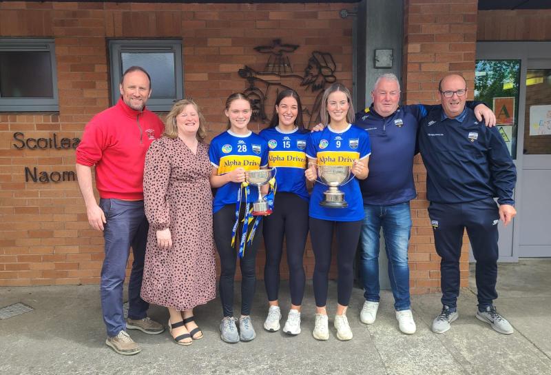 Past pupils return to St John the  Baptist school in Cashel with the cups! 
