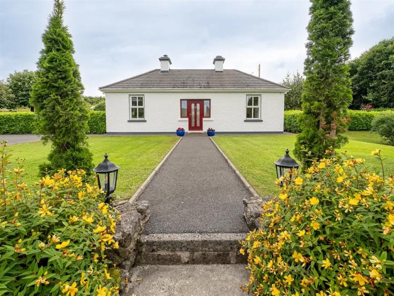 Two bedroom home with stunning gardens and mountain views is on sale in