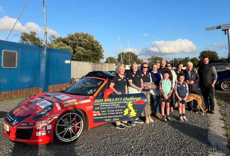 Couple undertaking charity drive in Porsche stop at Tipperary RNLI station
