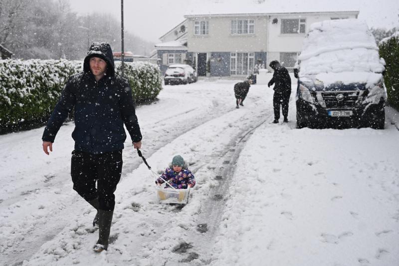 HAVING FUN IN THE SNOW - Tipperary children enjoy the novelty of the weather conditions