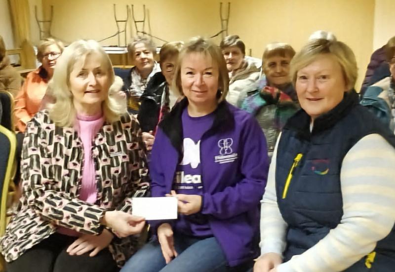 Local Tipperary social club presents generous donation to charity