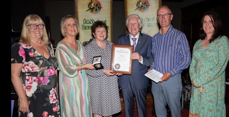 A Tipperary musician is honoured for her role in the promotion and teaching of music