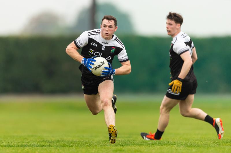 JK Brackens find their way past a stubborn challenge from Arravale Rovers