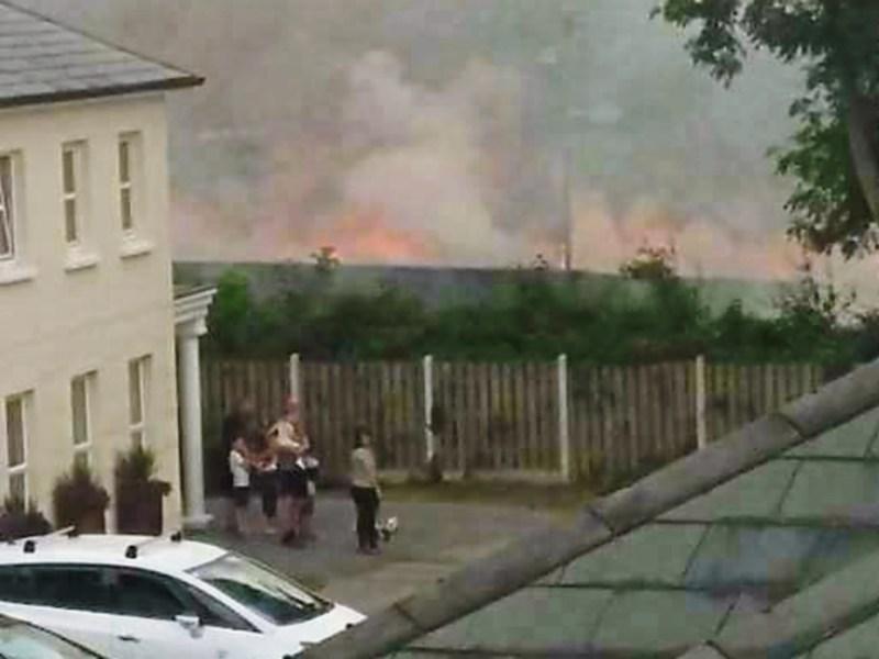 Grass fire erupts dangerously close to Clonmel housing estate