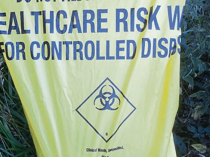 Waste disposal bags carrying healthcare risk warning dumped in Tipperary ditch