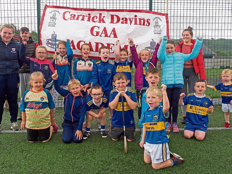 Fifty young GAA stars of the future cheer on Tipperary hurlers at Carrick Davins Cúl Camp