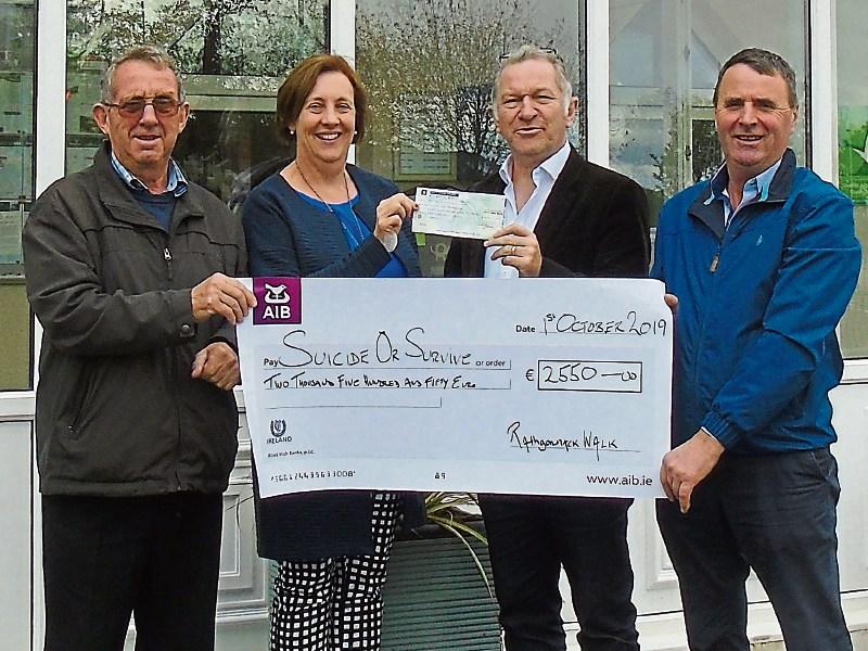 Rural community near Carrick-on-Suir presents sponsored walk proceeds to suicide prevention charity